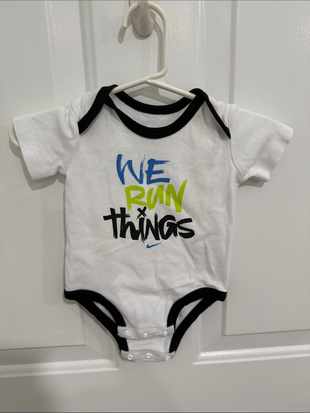 Nike White Baby One-Piece with Blue, Green & Black Graphic